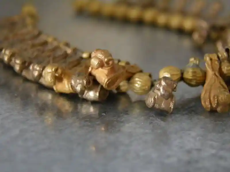 Gold necklace, sheep design